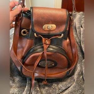 leather back pack. Vintage. Brown and Black. Mint condition. Drawstring.